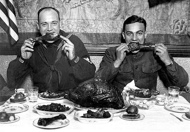 American servicemen chow down to a turkey dinner in 1918