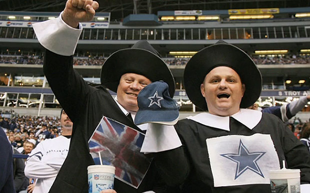 Dallas Cowboys fans cheer for their team on Thanksgiving Day